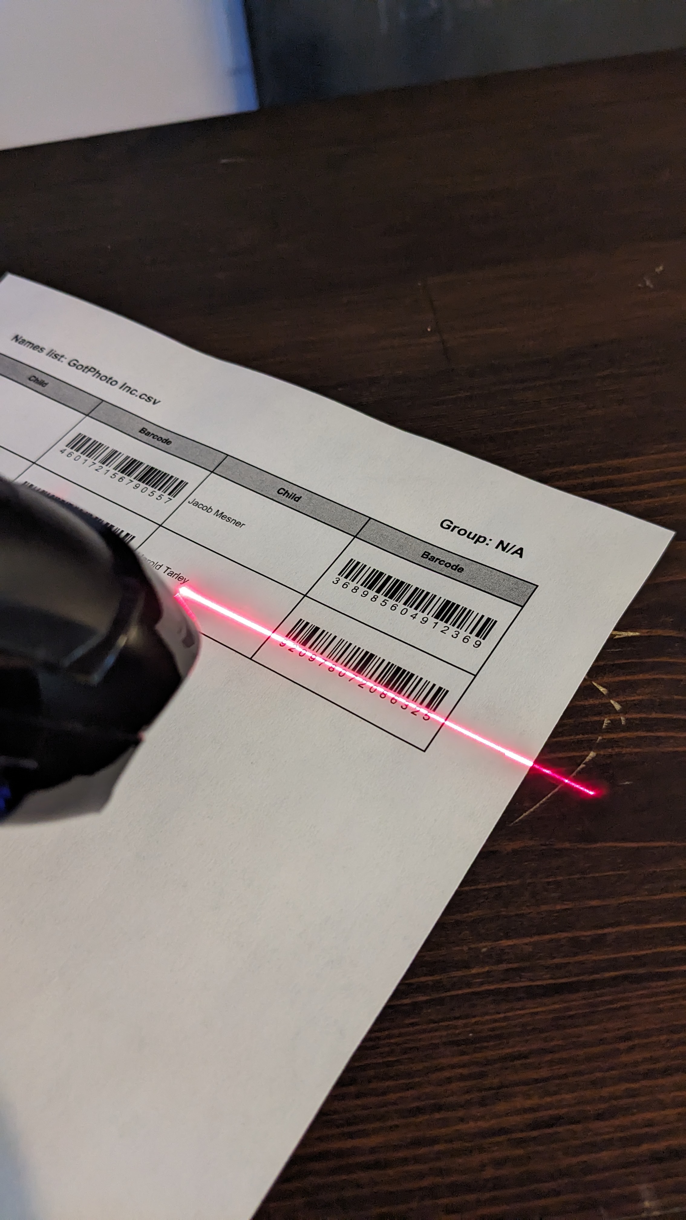 Photographer scanning employee barcode
