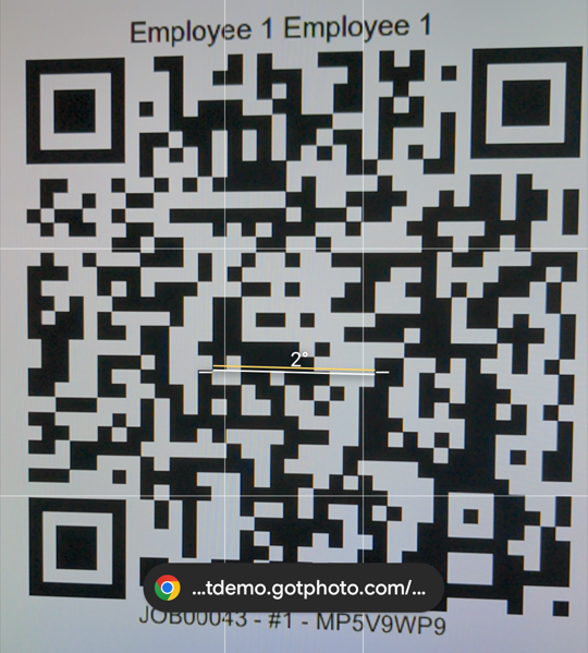 Employee scanning QR code with smartphone